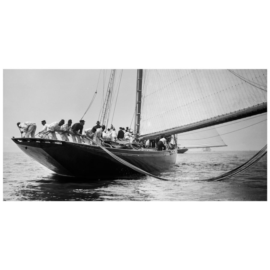 Unframed Black and White, Silver Gelatin, Limited edition Photograph of sailing yacht Prince of Wales Yacht Britannia when all the sailors are puling the rope from the water. Taken by a talented marine photographer Alfred John West in 1897. Available to purchase in various sizes from the Brett Gallery. This picture was developed in the darkroom and scanned from original glass plat negative from period. Beken of Cowes Framed Prints, Beken of Cowes archives, Beken of Cowes Prints, Beken Archive, Cowes Week old Photographs, Beken Prints, Frank beken of Cowes.